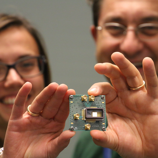  Ericsson researchers, Antonio D’Errico and Teresa Pepe, showing graphene-based photonic switch. Credit: Ericsson