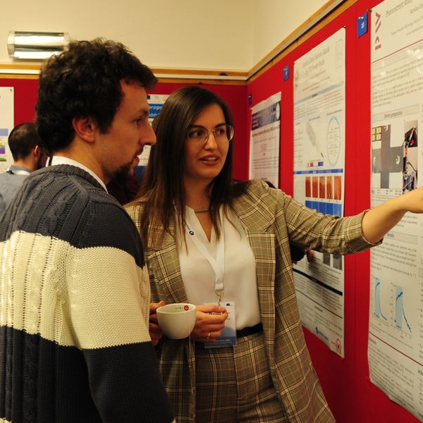 Two people attenting a poster session.
