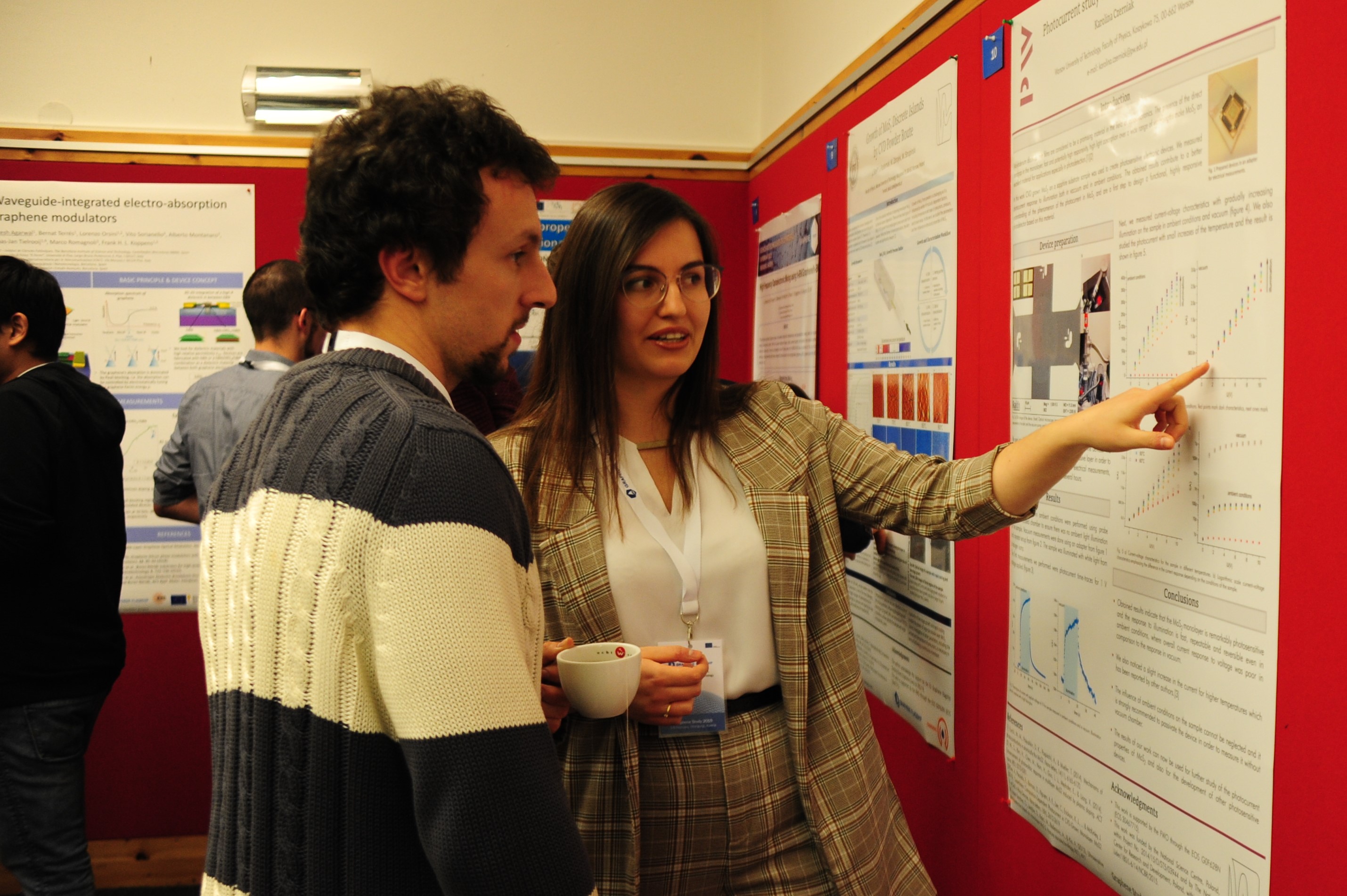 Two people attenting a poster session.