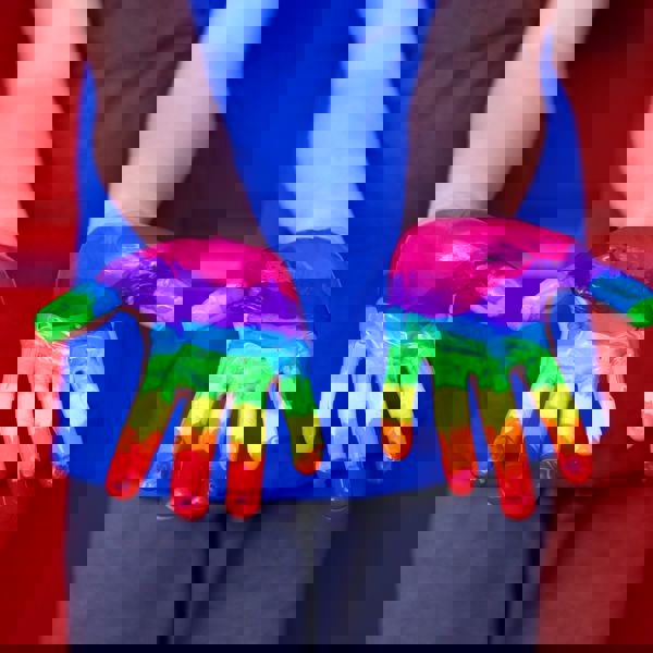 Hand with painted rainbow