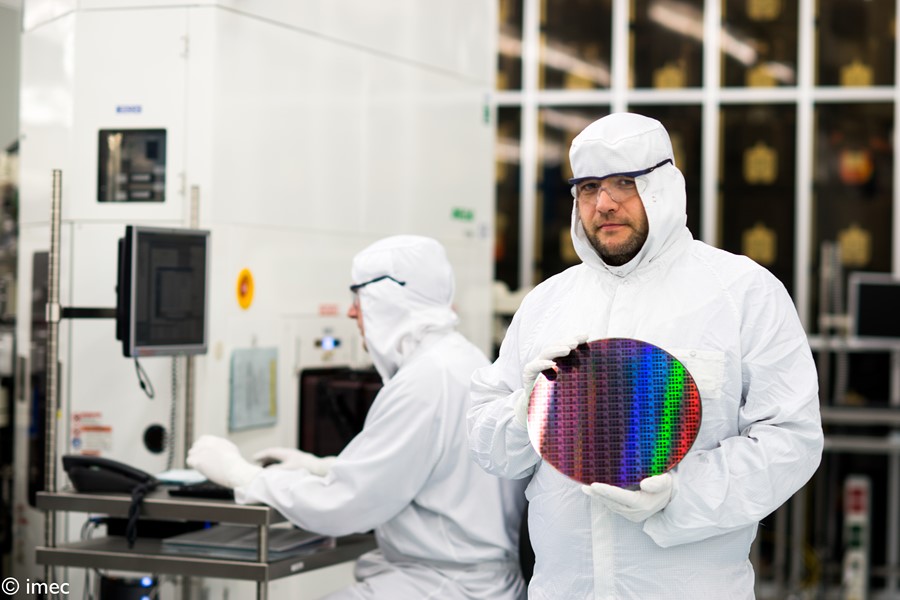 Cleanroom worker holding a wafer