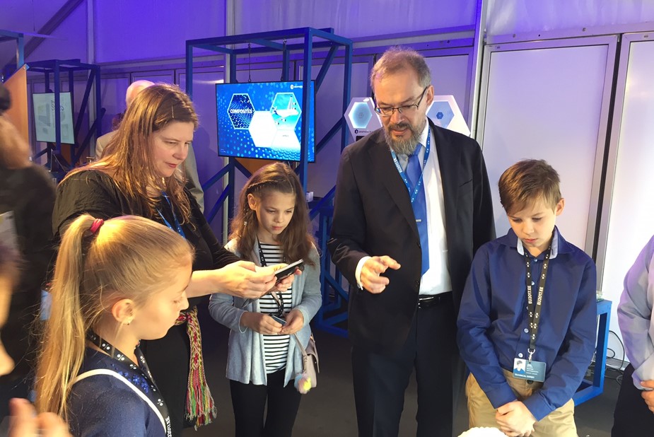 Graphene Flagship Director Jari Kinaret explains graphene to children visiting the Graphene Flagship booth at Tallinn Digital Summit 2017