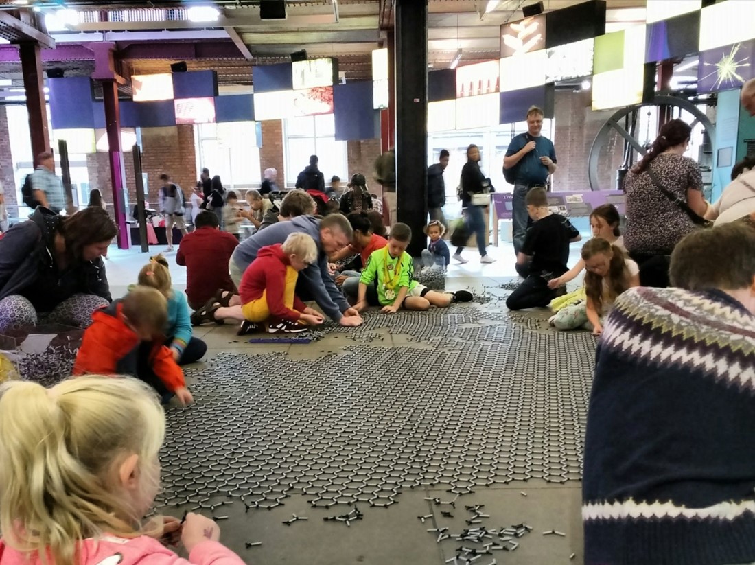children and families create a graphene carpet