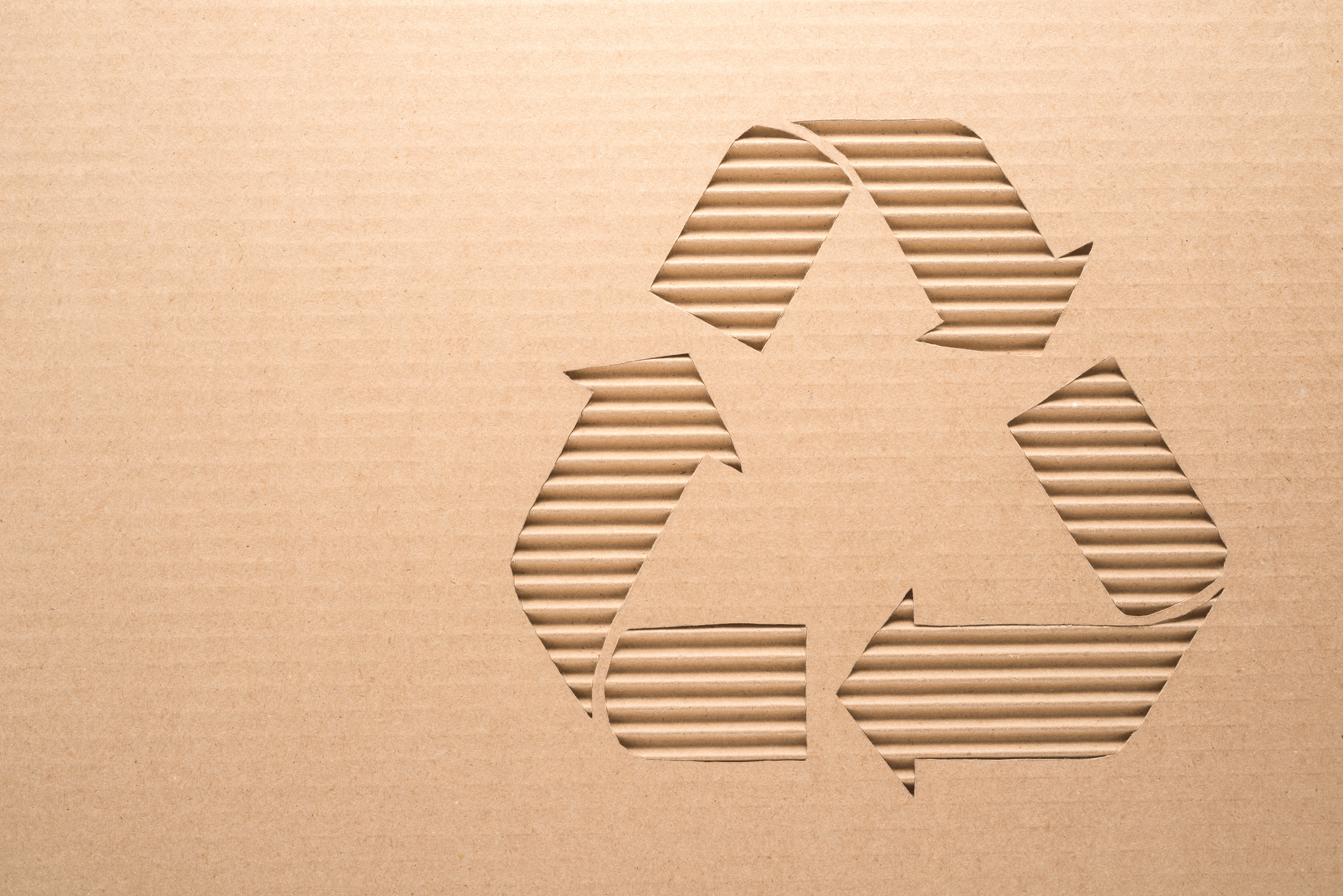 Beige recycle symbol on beige background 